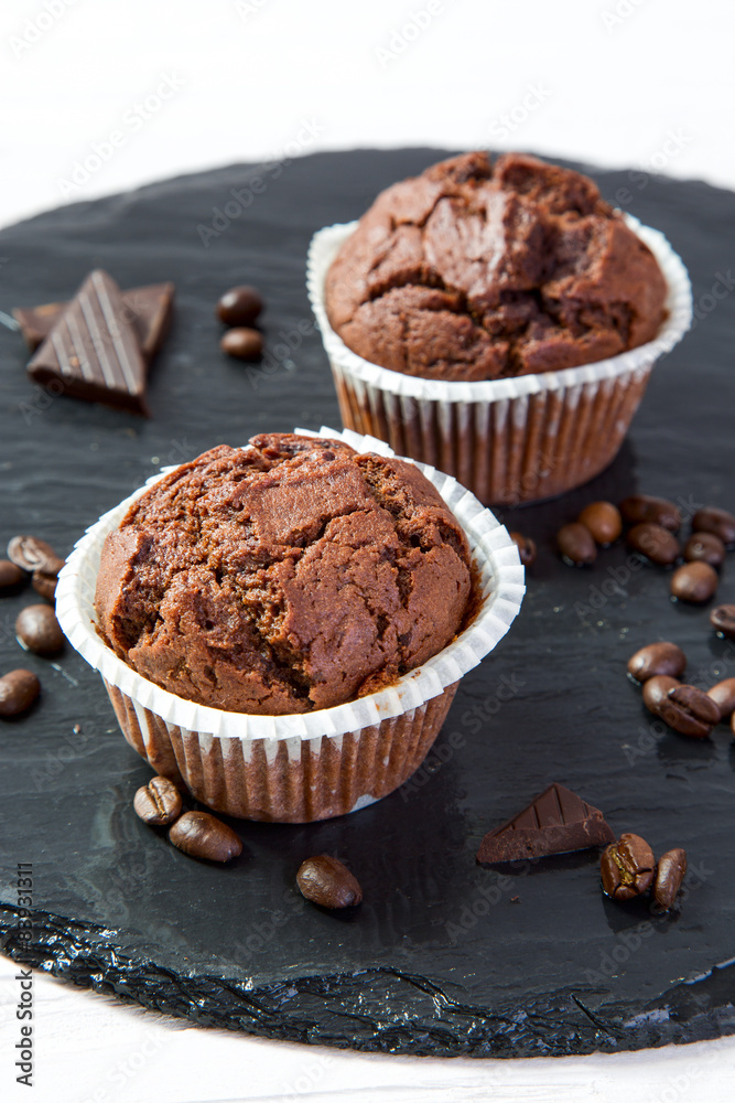 Chocolate muffins on a black tray Chocolate muffins on a black tray