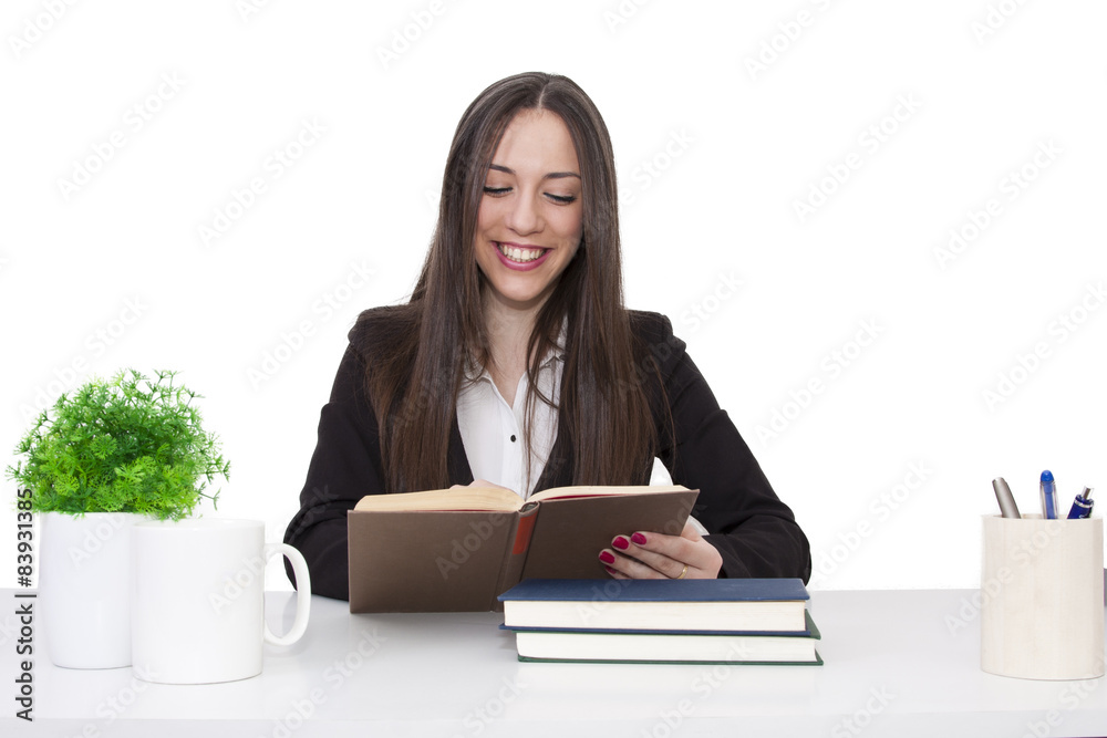 Business woman at the office reading Business woman at the office reading
