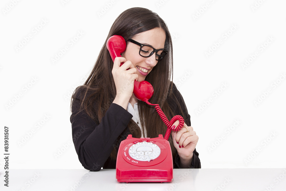 Business woman talking on the phone cord Business woman talking on the phone cord