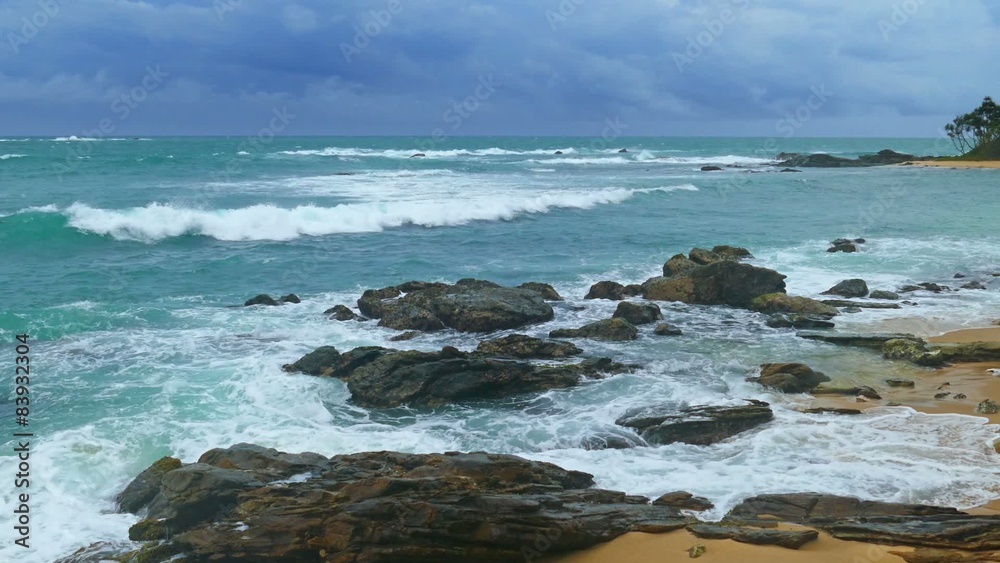 Sea stormy landscape over rocky coastline in Indian ocean
Sea stormy landscape over rocky coastline in Indian ocean