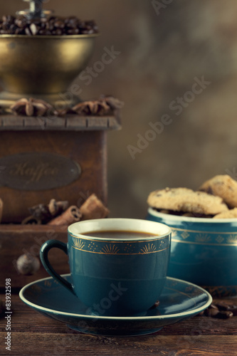 Coffee cup, cookies and old coffee grinder