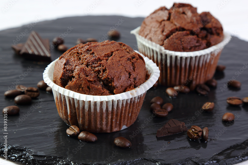 Chocolate muffins on a black tray Chocolate muffins on a black tray