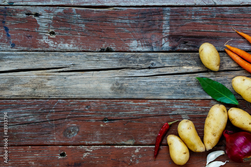Organic vegetables on rustic wooden table. 