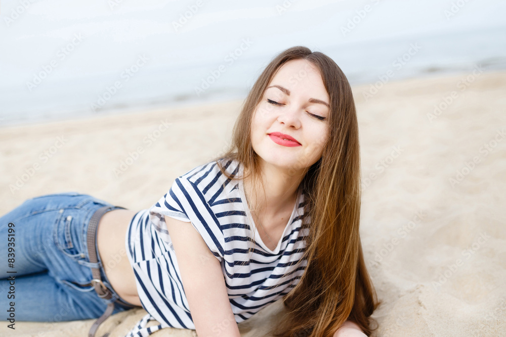 Beautiful stylish girl on sea beach