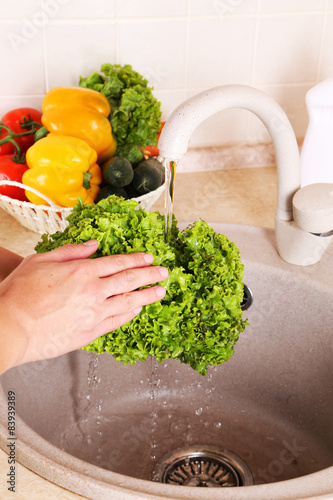 Vegetables washing in kitchen
