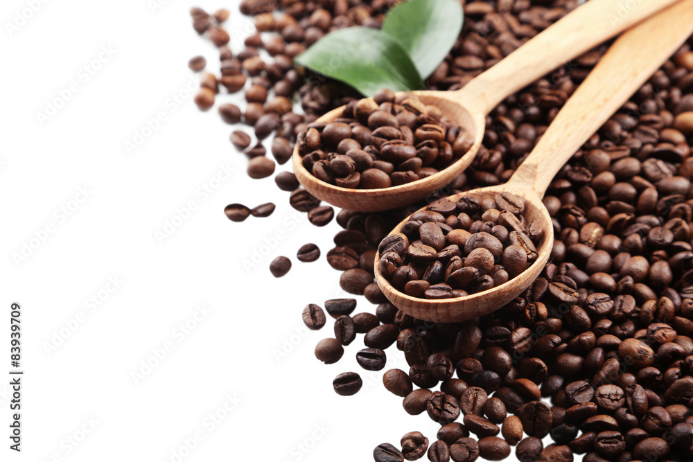 Coffee beans in a spoon on white background Coffee beans in a spoon on white background