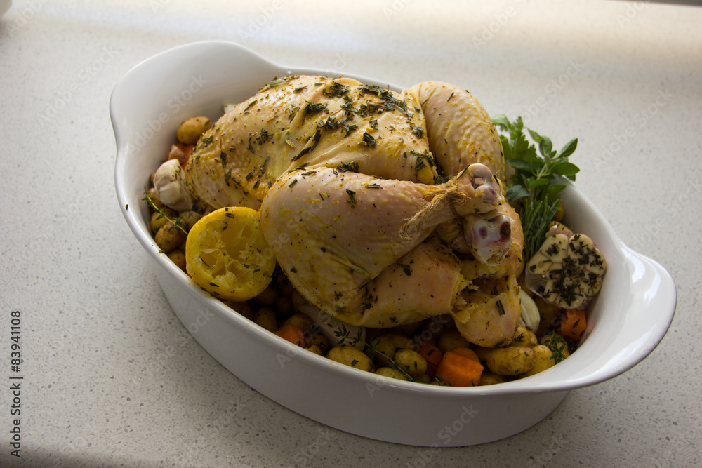 Whole bird chicken for roasting spices, herbs and vegetables