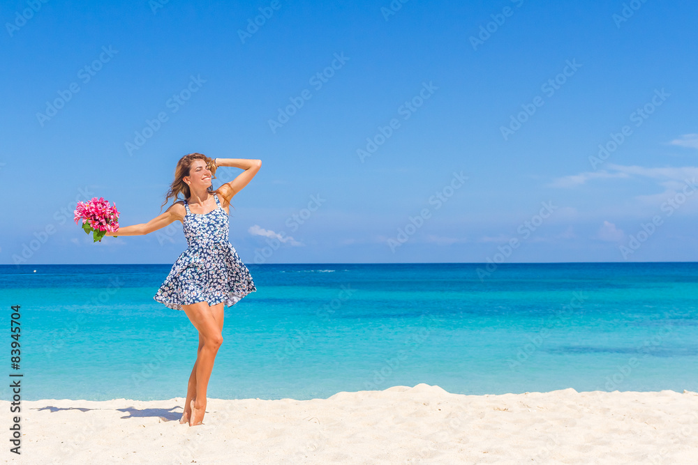 young happy girl with flower bouquet on tropical sea and beach b young happy girl with flower bouquet on tropical sea and beach b