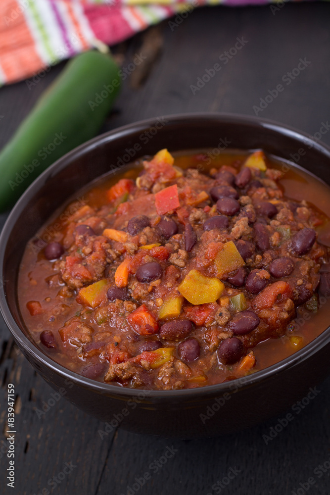 chili con carne beef chili on black table chili con carne beef chili on black table