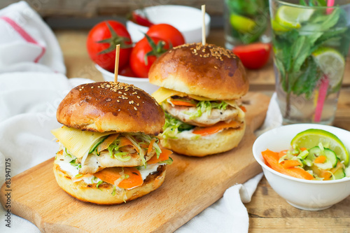 burgers with chicken and stuffed  juicy with cucumber, carrots a