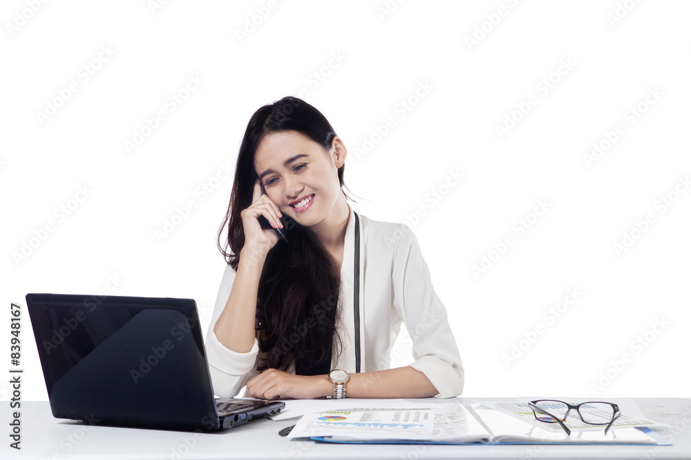 Female entrepreneur talking on the cellphone Female entrepreneur talking on the cellphone
