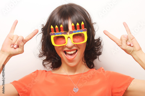 young happy woman with big orange sunglasses