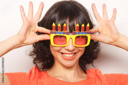 young happy woman with big orange sunglasses