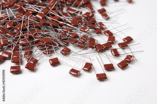 Plenty of Capacitors Placed On White Surface Bulk photo