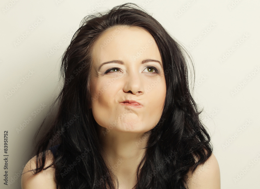 Portrait of a beautiful young woman thinkin Portrait of a beautiful young woman thinkin