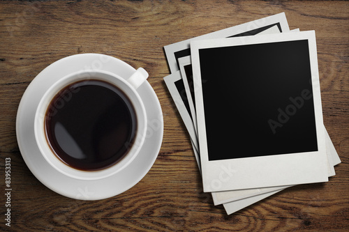 coffee cup and polaroid pho...