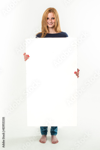 Young woman holding a blank banner