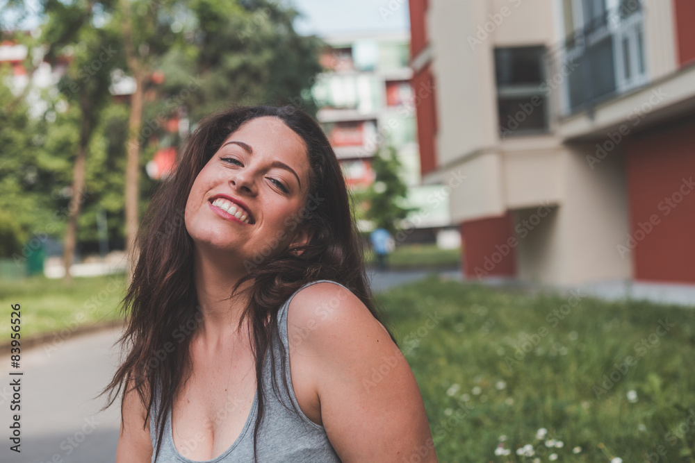 Beautiful curvy girl posing in an urban context Beautiful curvy girl posing in an urban context