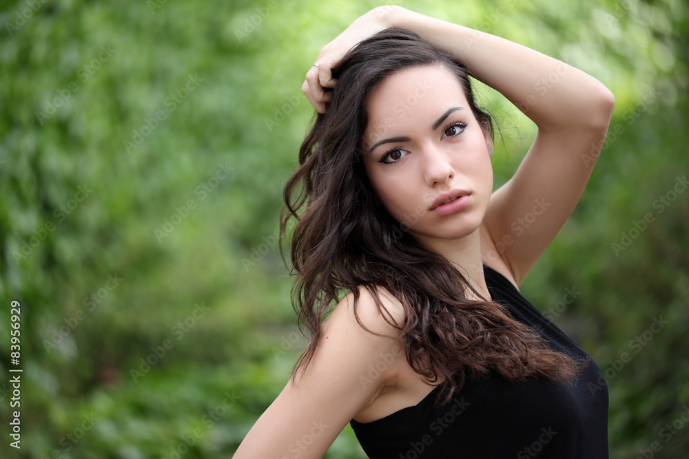 Sensual young woman portrait outdoors in a park Sensual young woman portrait outdoors in a park