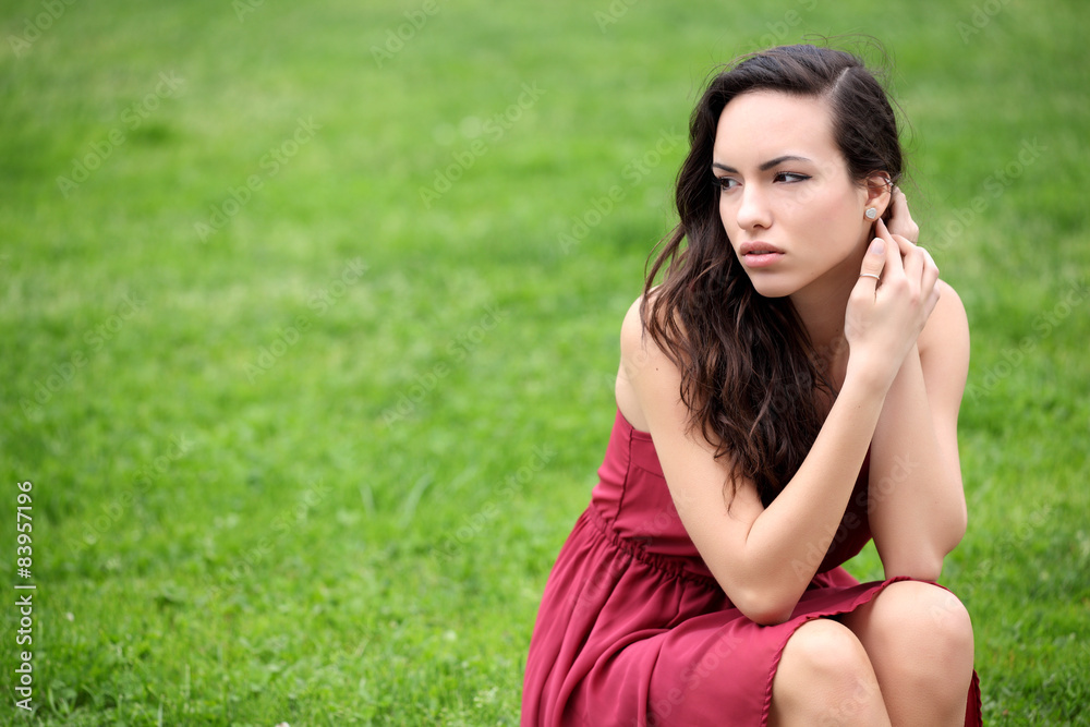 Sensual young woman portrait outdoors in a park Sensual young woman portrait outdoors in a park