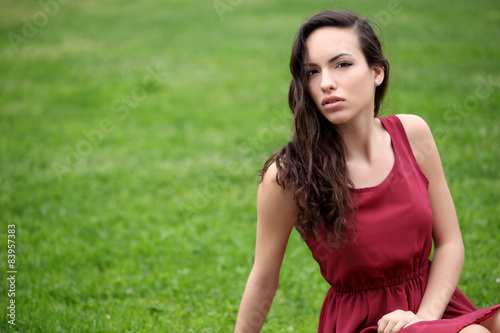 Sensual young woman portrait outdoors in a park