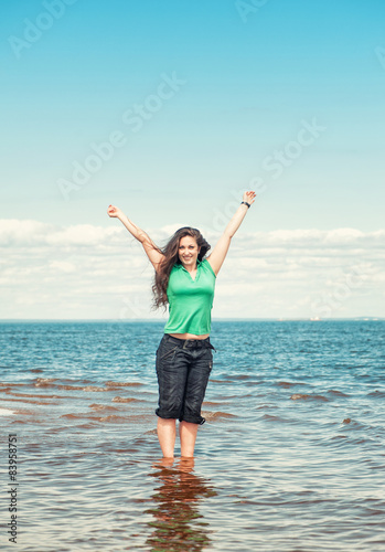 Happy woman in the water of sea
