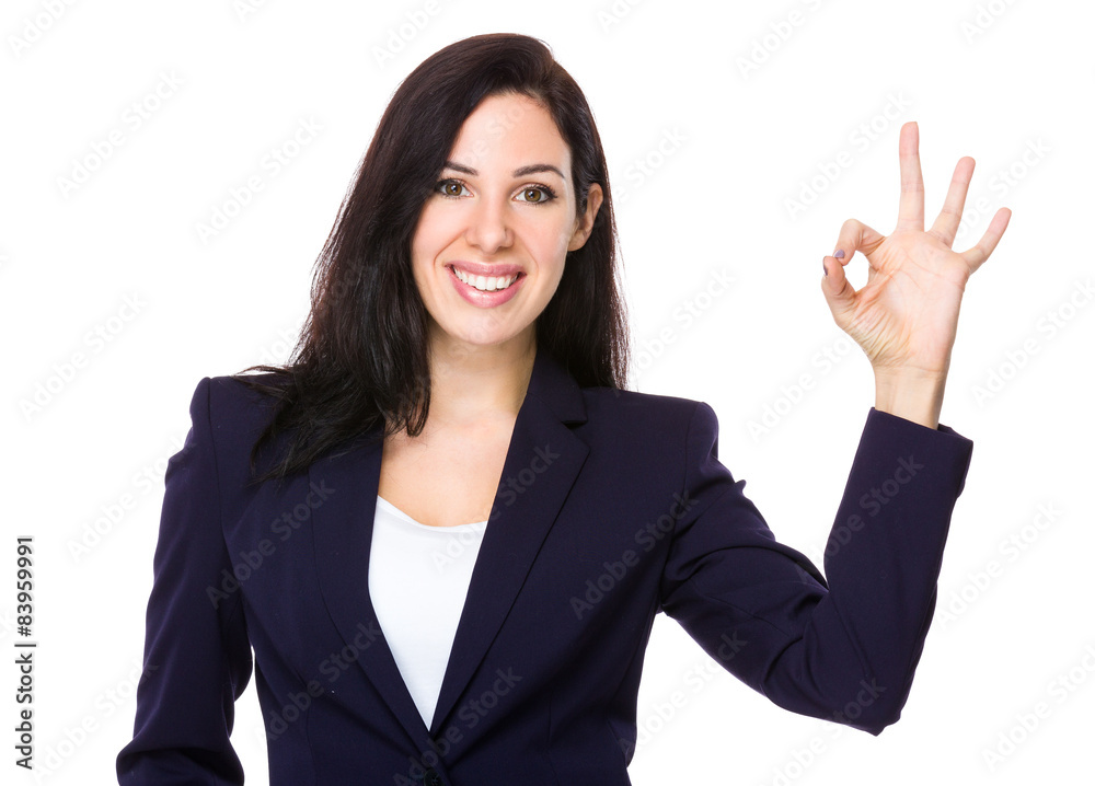 Confident businesswoman with ok sign gesture Confident businesswoman with ok sign gesture