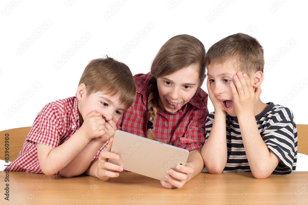 Astonished Brothers and Sister With Digital Tablet Isolated Astonished Brothers and Sister With Digital Tablet Isolated
