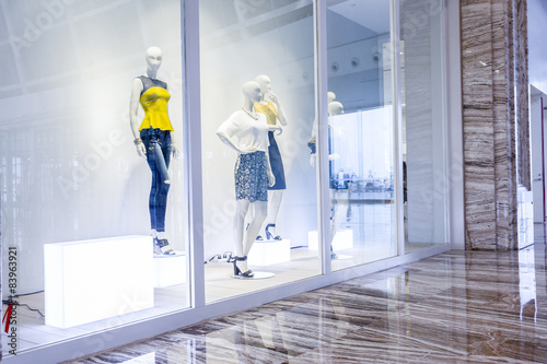 mannequins in fashion shop display window © zhu difeng