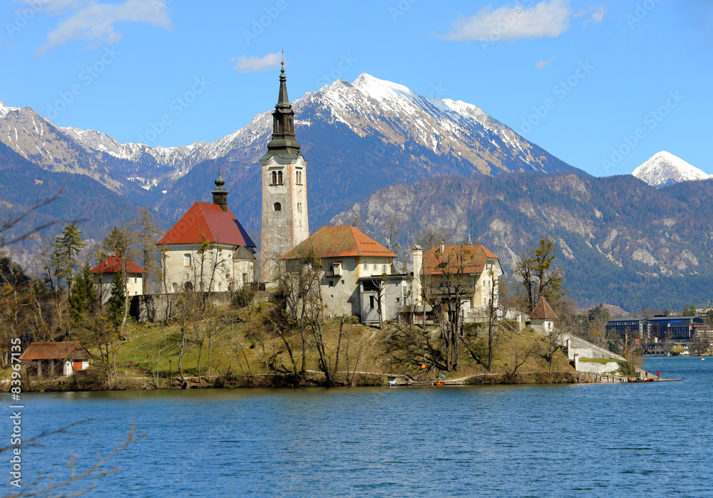 Church on the island of Lake BLED in SLOVENIA and the snowy moun