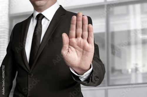 Schilderij op canvas Hand Stop wird von Geschäftsmann gezeigt