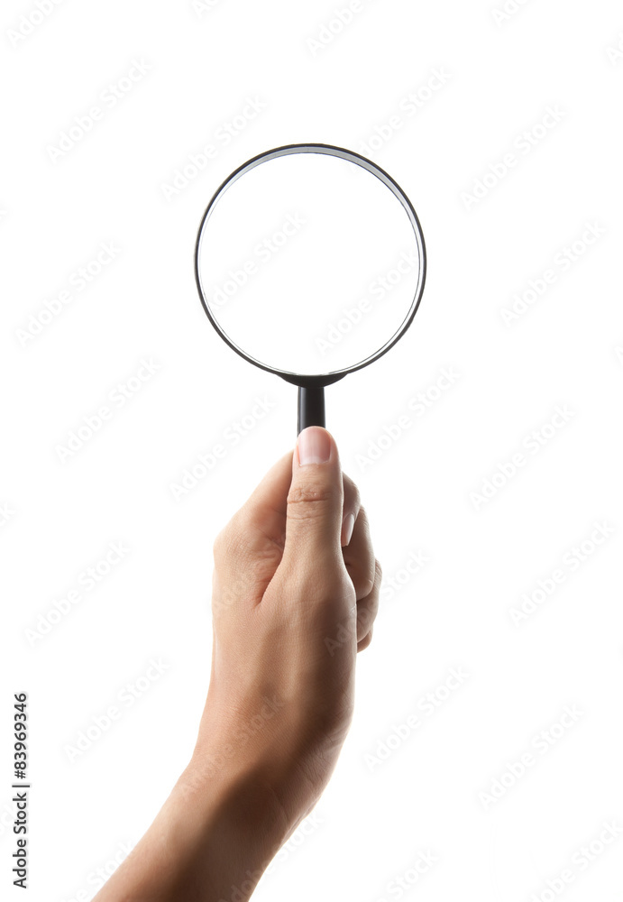 Hand holding magnifying glass isolated on white background