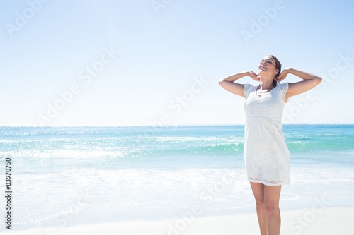 Pretty brunette relaxing beside the water © WavebreakmediaMicro