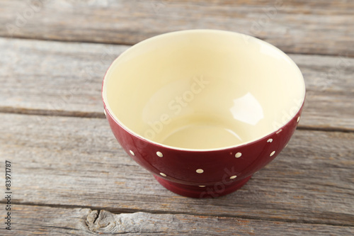 Empty bowl on grey wooden background