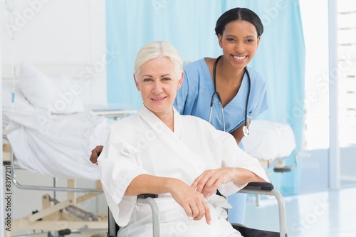 doctors and patient in wheelchair 