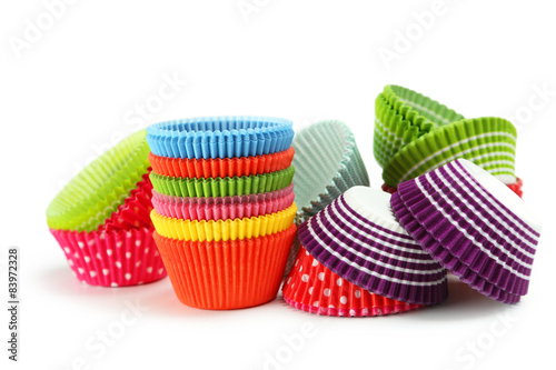 Empty colorful cupcake cases isolated on white