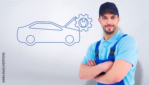 Composite image of smiling male handyman in coveralls