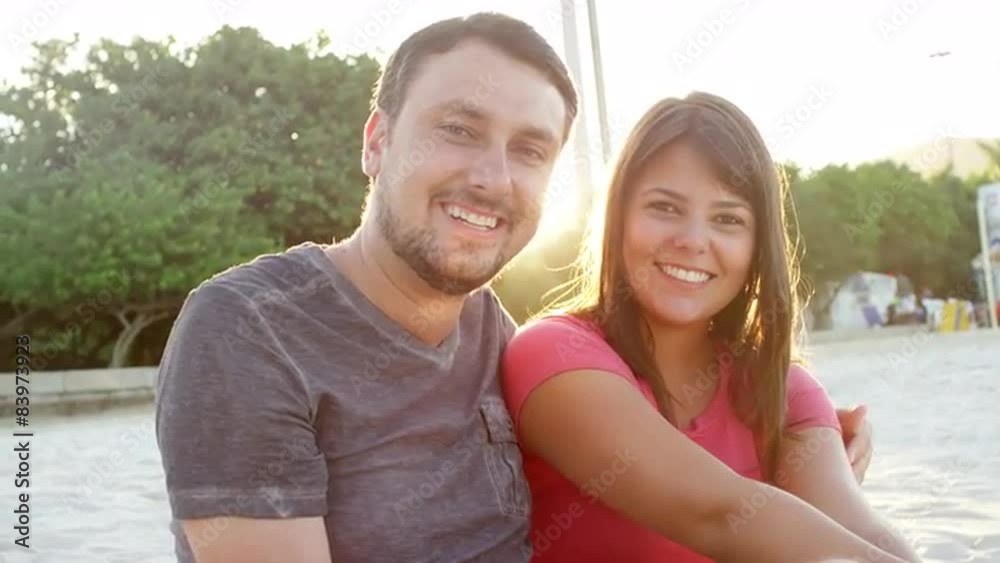 Brazilian couple smile on a beach in Brazil Brazilian couple smile on a beach in Brazil