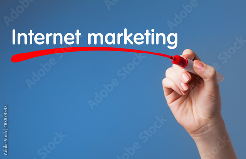 Hand writing Internet marketing red marker on transparent wipe b