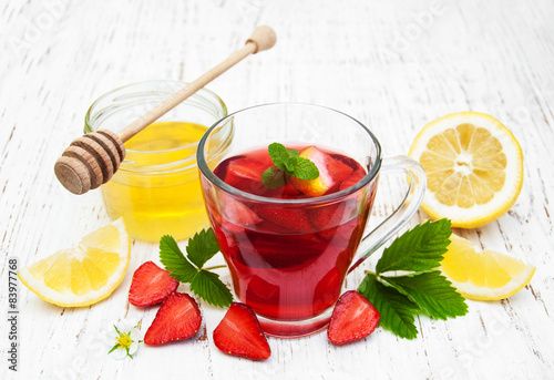 Fruit tea with strawberries and honey