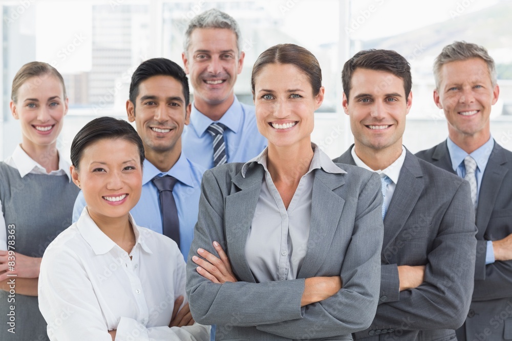 Business people looking at camera with arms crossed Business people looking at camera with arms crossed