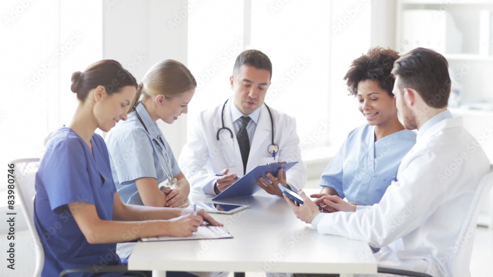group of happy doctors meeting at hospital office group of happy doctors meeting at hospital office
