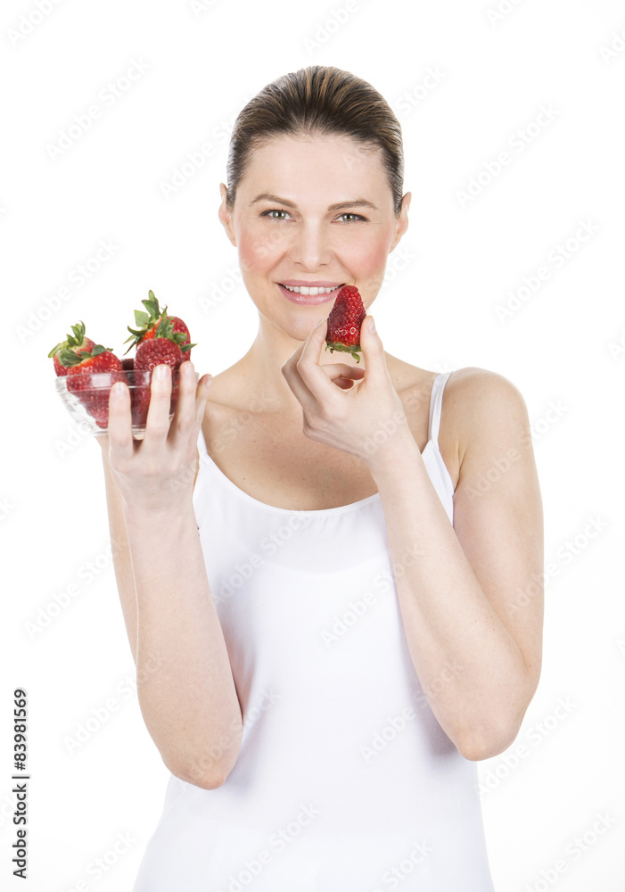 woman with white dress holding some strawberries. woman with white dress holding some strawberries.