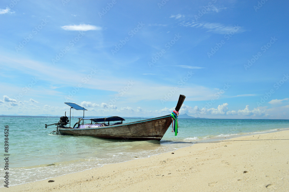 The wooden boat on a beach
