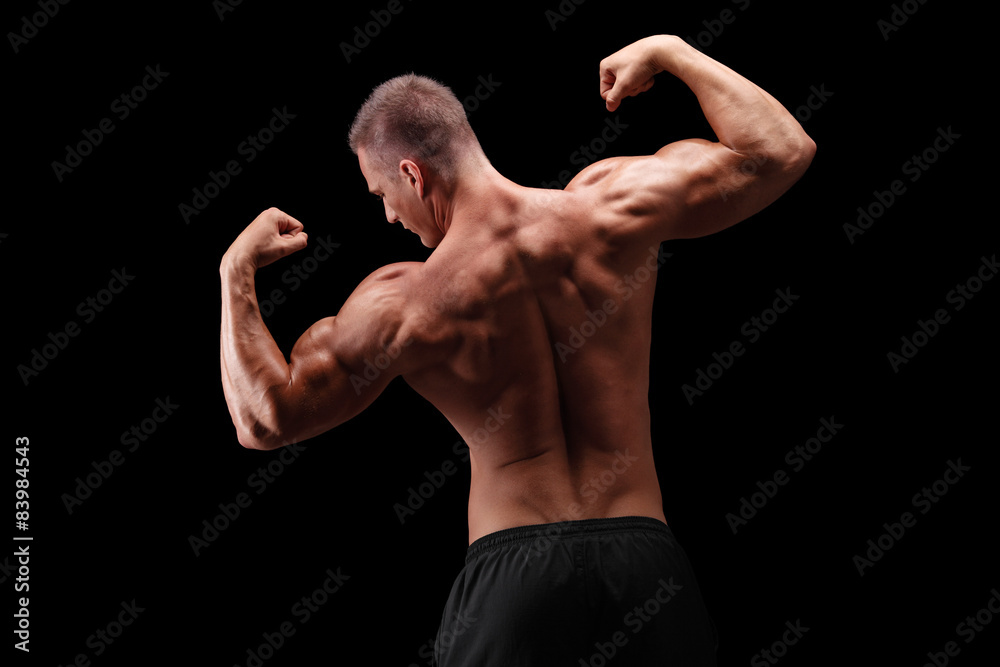 Handsome bodybuilder flexing his back muscles
