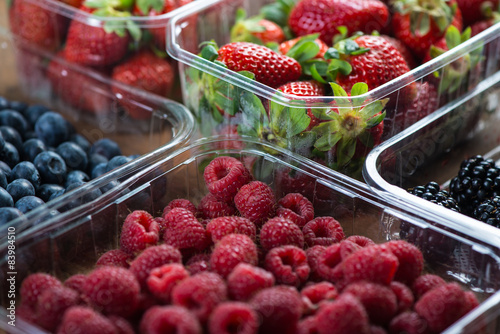 Farm fresh berries fruit in plastic trays