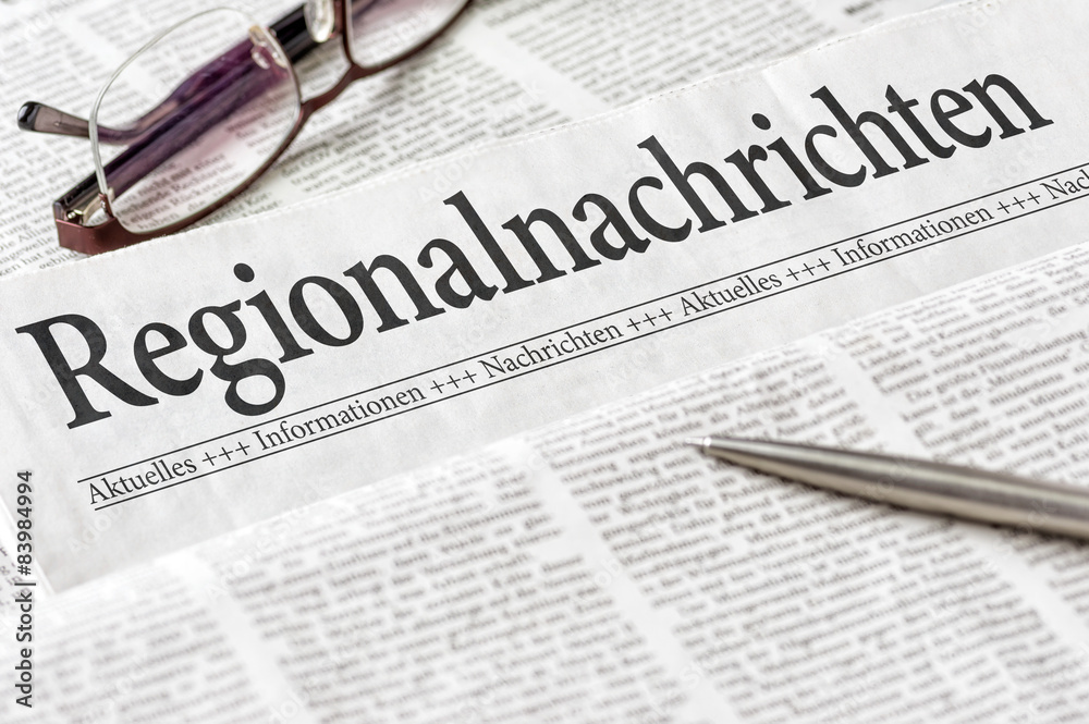 Zeitung mit der Überschrift Regionalnachrichten Zeitung mit der Überschrift Regionalnachrichten