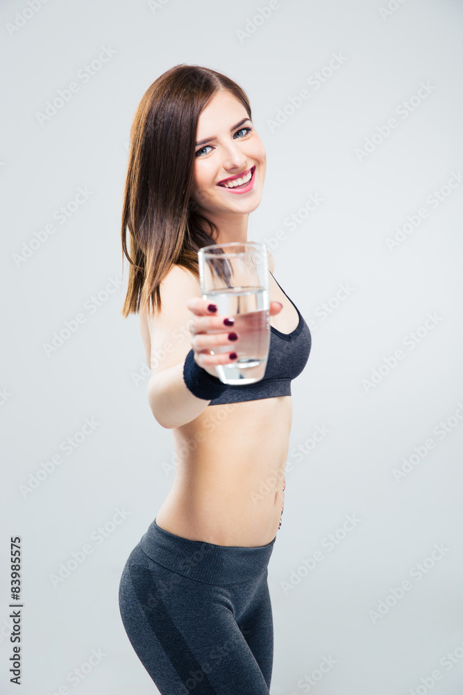 Sporty woman giving glass of water on camera Sporty woman giving glass of water on camera