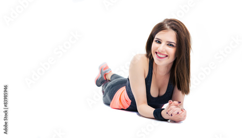 Sporty young woman lying on the floor