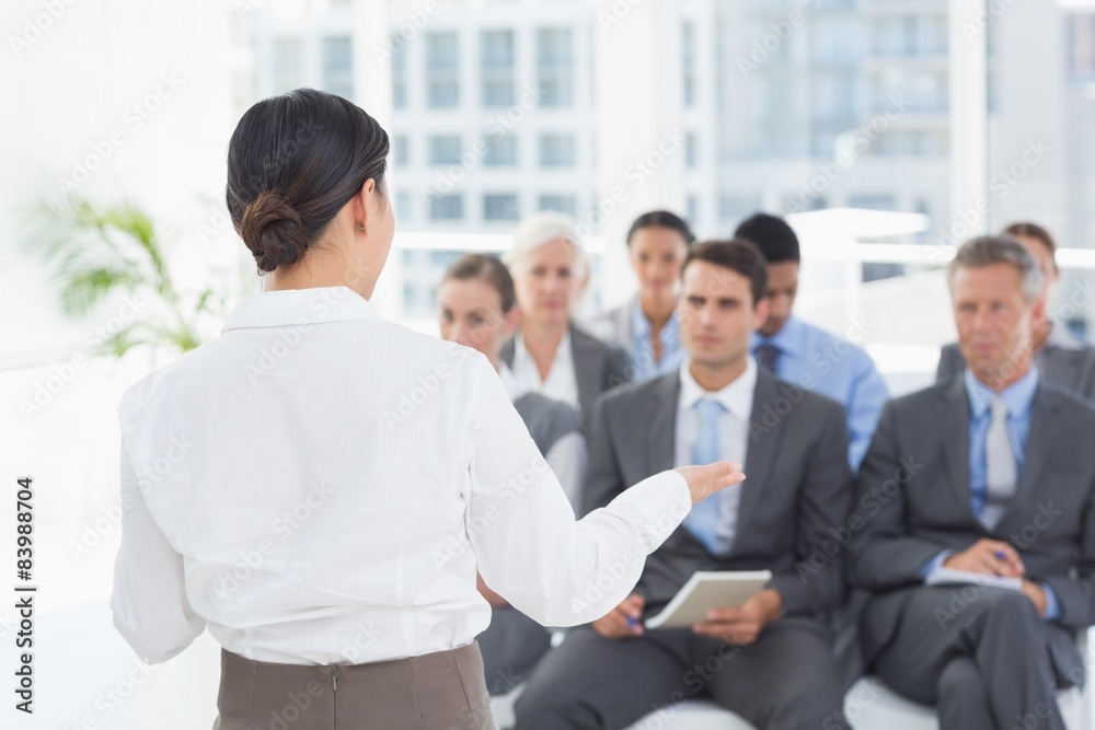 Businesswoman doing speech during meeting Businesswoman doing speech during meeting